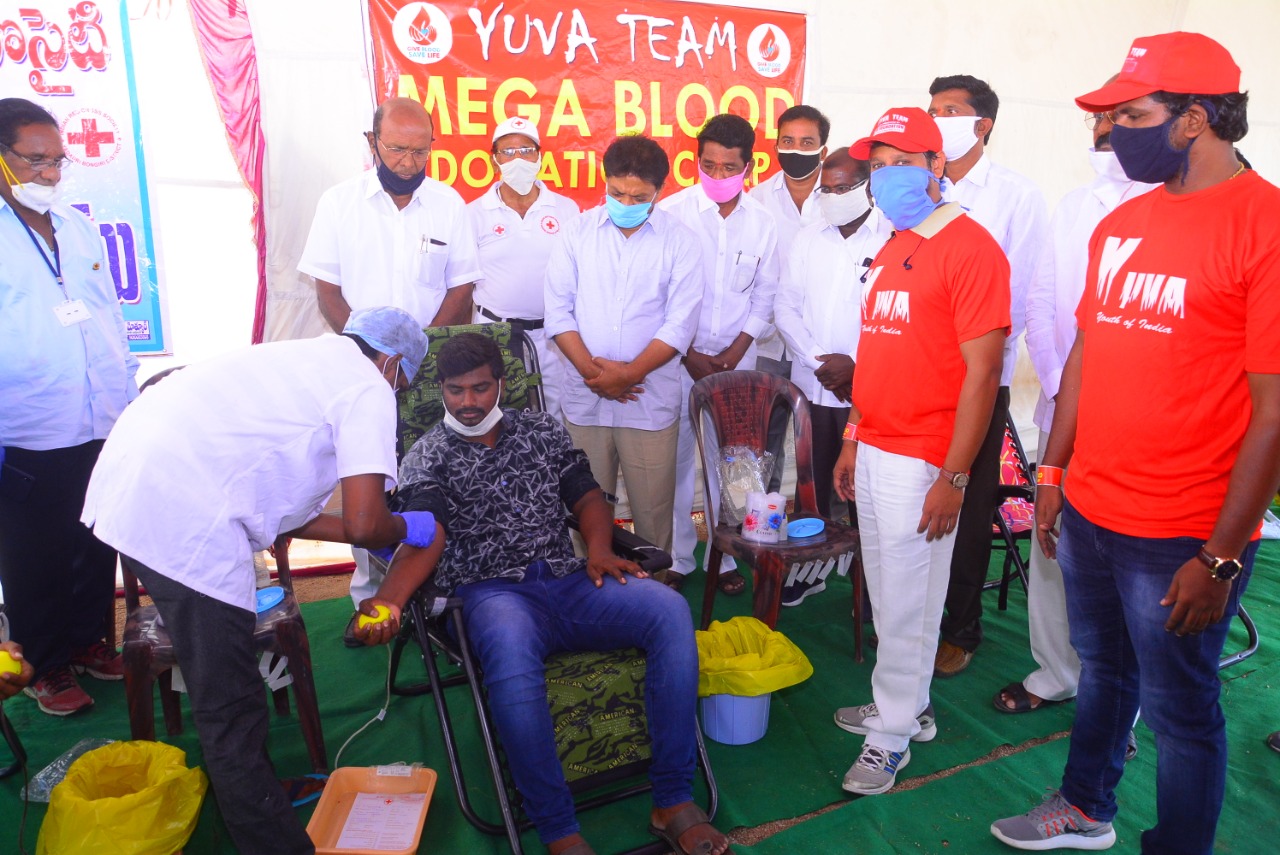 Image of a successful blood donation drive with happy volunteers.